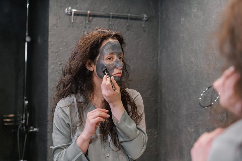 woman applying hair mask treatment at home