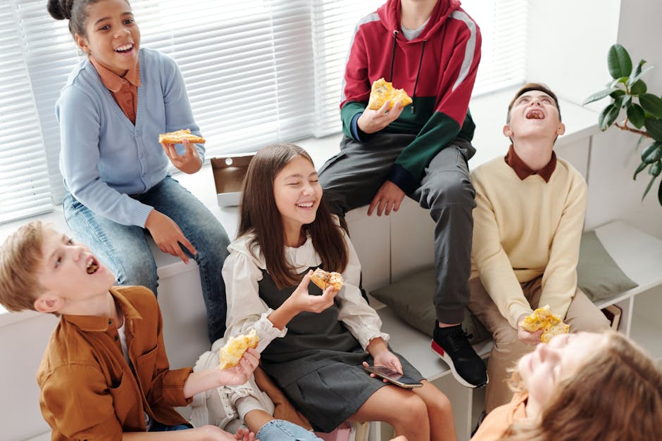 children eating snacks together laughing