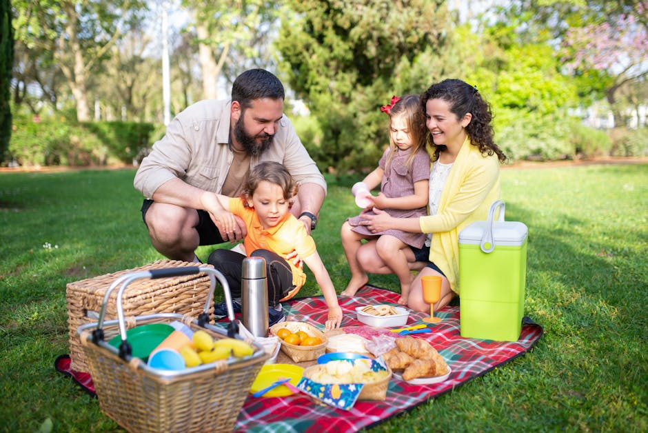 happy family picnic in the park eating