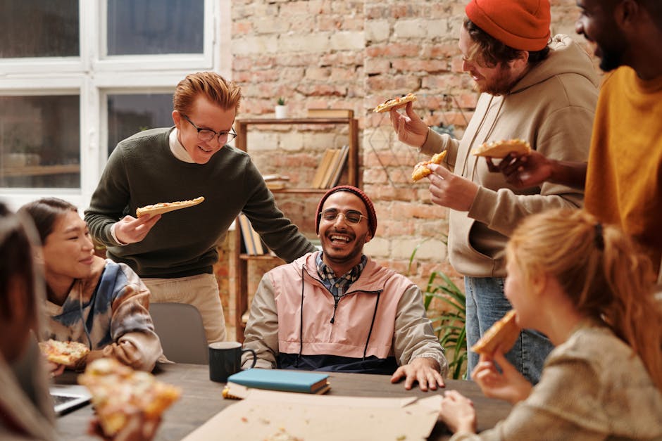 college students laughing and eating food