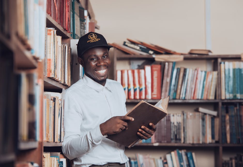 college student wearing baseball cap library