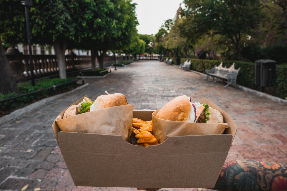 fried chicken in a cardboard box at a park