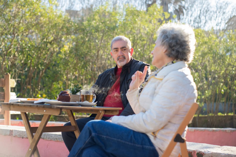 happy senior couple eating together outdoors