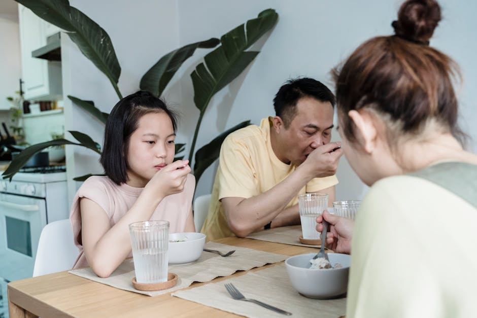 happy korean family eating dinner at home