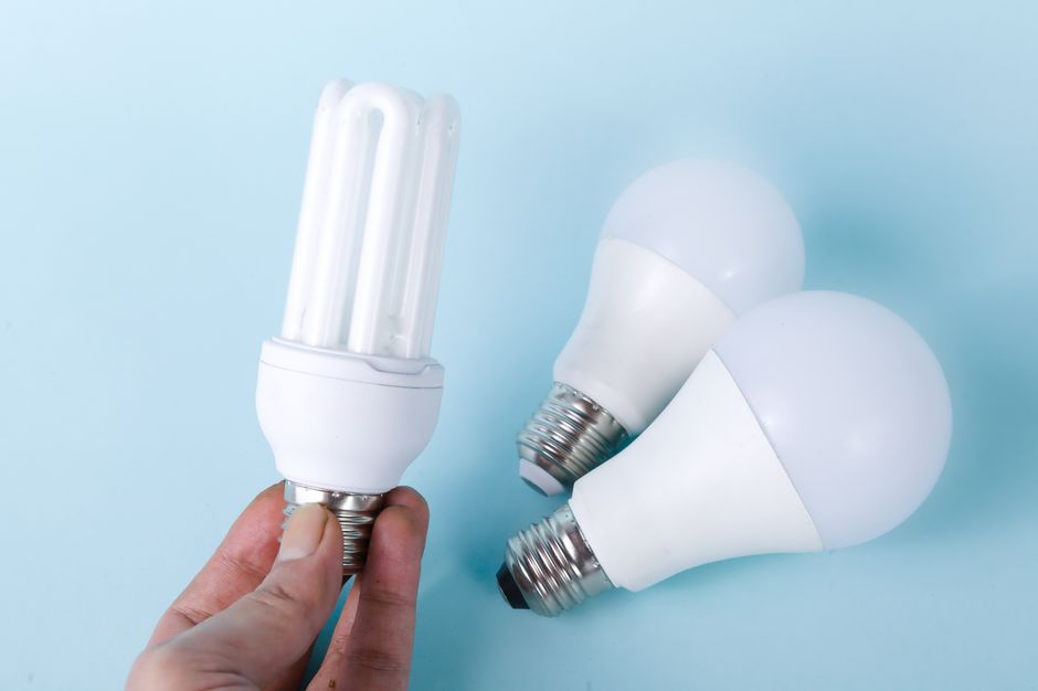 electricity bill saving concept money and light bulb