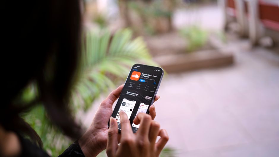 person checking weather forecast on smartphone