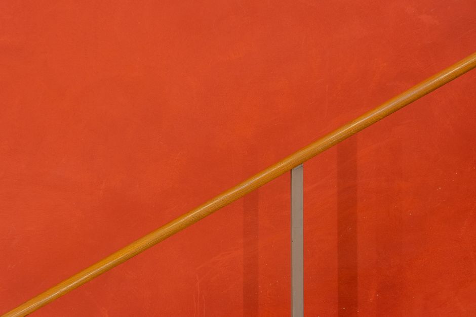 red clay plaster wall texture with wooden beam